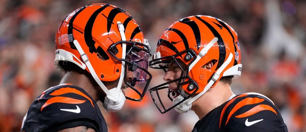 Bengals wide receiver Tee Higgins (5) and quarterback Joe Burrow (9) celebrate a touchdown in the fourth quarter against the Broncos at Paycor Stadium on Saturday, Dec. 28, 2024.