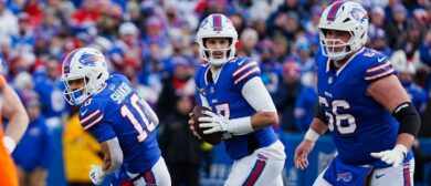 uffalo Bills quarterback Josh Allen (17) runs parallel looking for an open play during the second half of the Buffalo Bills wild card game against the Denver Broncos at Highmark Stadium in Orchard Park on Jan. 12, 2025.