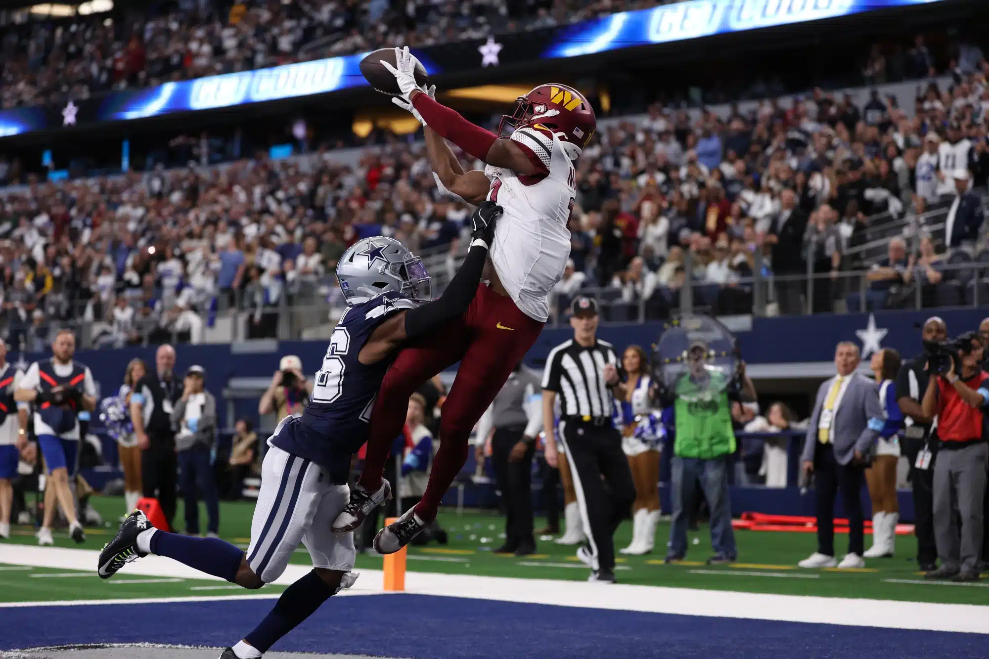 Terry McLaurin #17 of the Washington Commanders scores a receiving touchdown against DaRon Bland #26 of the Dallas Cowboys during the fourth quarter at AT&T Stadium on January 05, 2025 in Arlington, Texas.