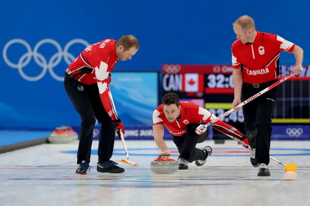 Geoff Walker, Brett Gallant and Mark Nichols of Team Canada compete against Team United States during the Men's Curling Bronze Medal Game at the Beijing 2022 Winter Olympic Games.