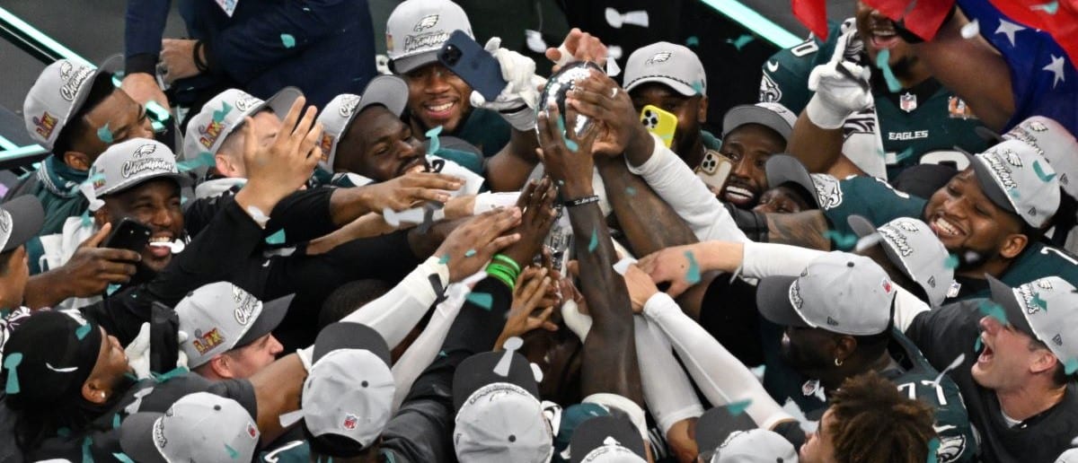 Philadelphia Eagles' players hold the Lombardi trophy after they defeated the Kansas City Chiefs 40-22 in Super Bowl LIX at Caesars Superdome in New Orleans, Louisiana, February 9, 2025.