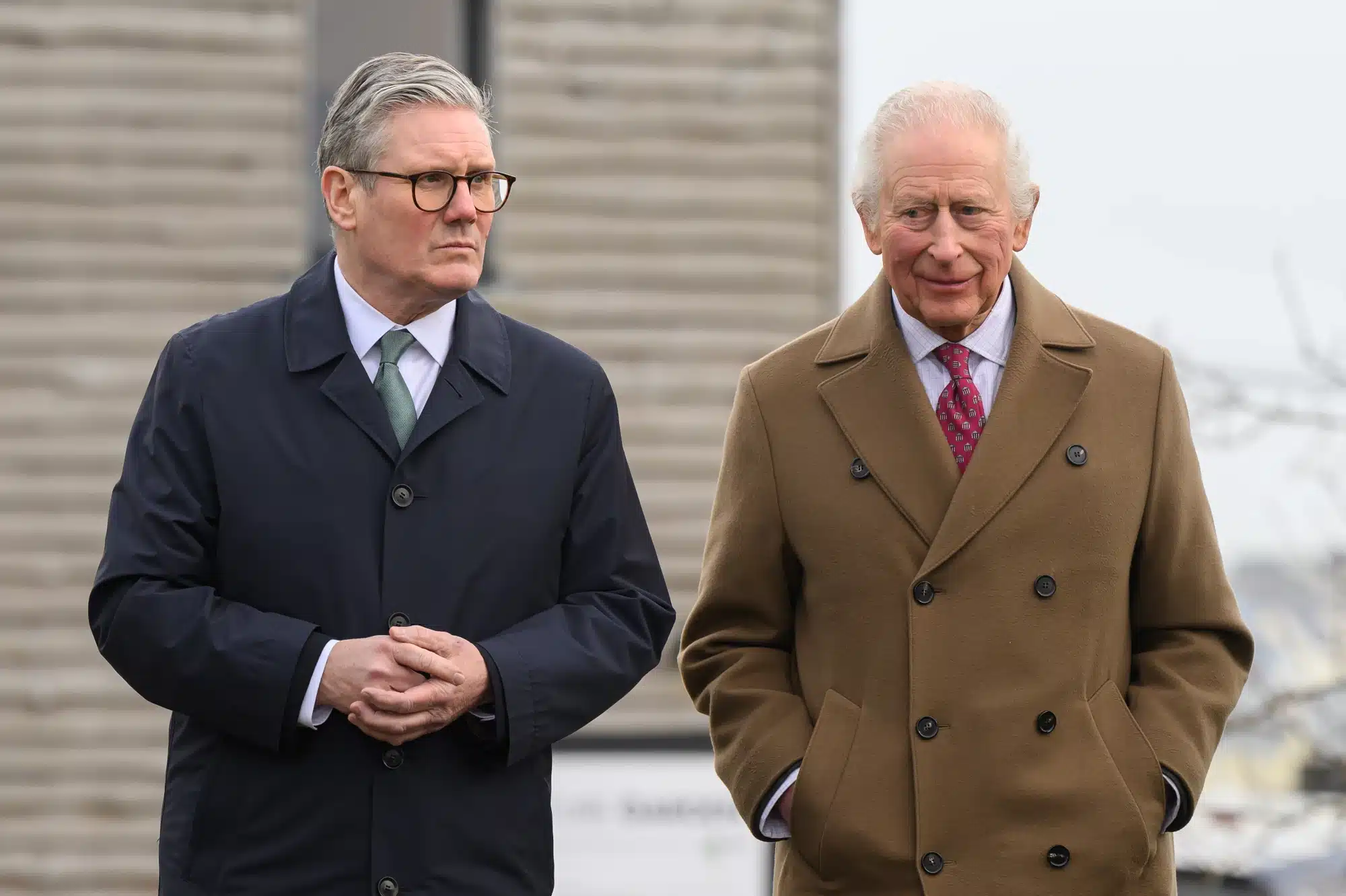 King Charles III and Britain's Prime Minister Keir Starmer take part in a tour of the Newquay Orchard on February 10, 2025 in Newquay, England.