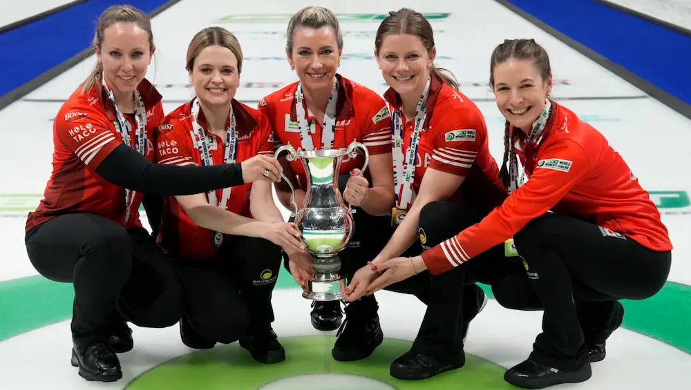 The Canadian women's curling team led by Rachel Hoffman posing with the gold medal and championship trophy at the 2024 Women's Curling Championship.